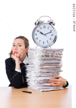 Woman businesswoman with giant alarm clock 6912209