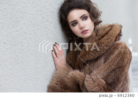 Loneliness. Winter. Beautiful Refined Female in Wool Fur Coat Loneliness. Winter. Beautiful Refined Female in Wool Fur Coat 6912360