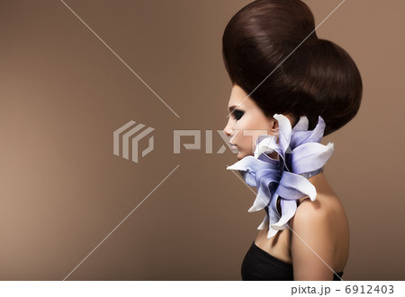 Styling. Gorgeous Fashion Woman with Trendy Hairstyle. Brown Hairs Styling. Gorgeous Fashion Woman with Trendy Hairstyle. Brown Hairs 6912403