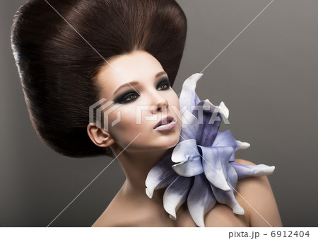 Extravagance. Classy Woman with Lily. Stylish Hairdo. Luxury Extravagance. Classy Woman with Lily. Stylish Hairdo. Luxury 6912404