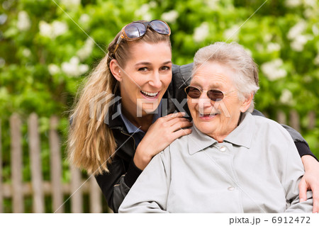 Young woman is visiting her grandmother in nursing home 6912472