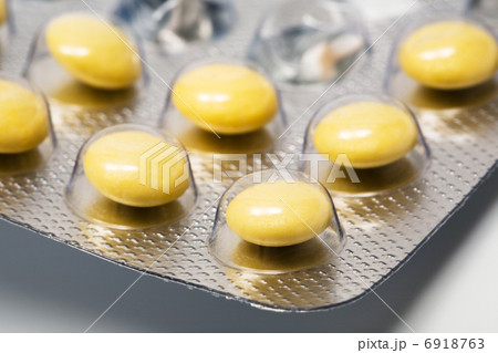Yellow and round pills 6918763