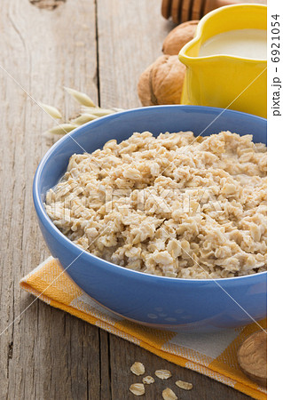 bowl of oatmeal on wood bowl of oatmeal on wood 6921054