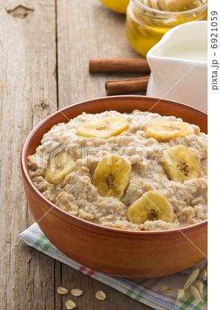 bowl of oatmeal on wood bowl of oatmeal on wood 6921059