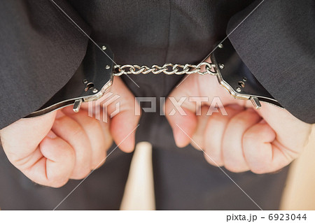 Attrested businessman clenching fists Attrested businessman clenching fists 6923044
