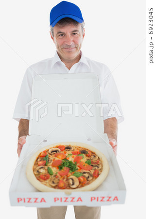 Mature delivery man holding pizza Mature delivery man holding pizza 6923045