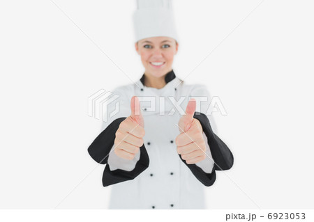 Happy female chef gesturing thumbs up Happy female chef gesturing thumbs up 6923053