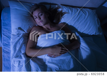 Hight angle view of cute woman sleeping 6923058