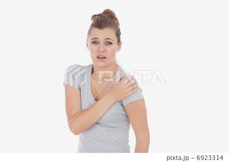 Portrait of woman suffering from shoulder pain Portrait of woman suffering from shoulder pain 6923314