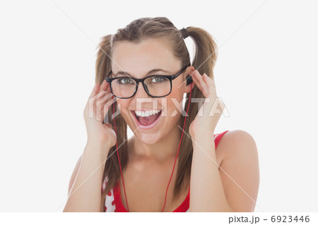Happy young woman listening music 6923446