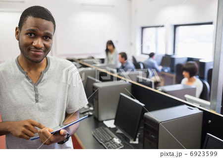 Student in computer room using tablet pc Student in computer room using tablet pc 6923599