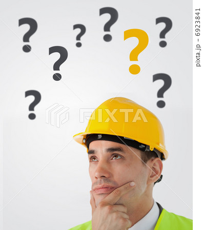 Man in hard hat thinking 6923841