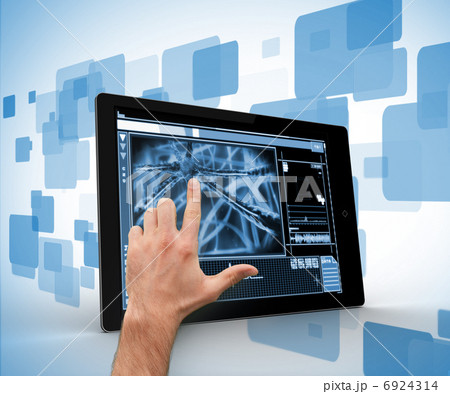 Hand touching a digital tablet on a digitally generated backgrou Hand touching a digital tablet on a digitally generated backgrou 6924314