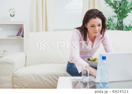 Young woman using laptop at home Young woman using laptop at home 6924521
