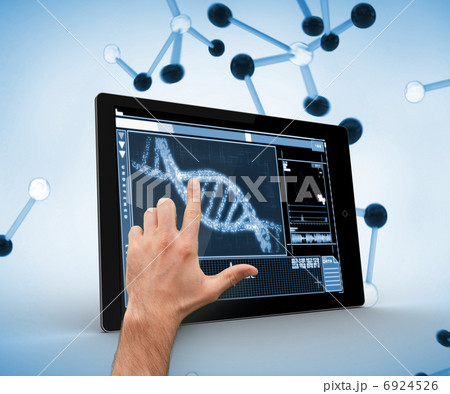 Hand touching a dna on a digital tablet 6924526