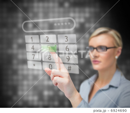 Businesswoman dialing number 6924690
