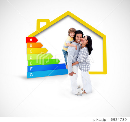 Smiling family standing with a yellow house illustration with en Smiling family standing with a yellow house illustration with en 6924789