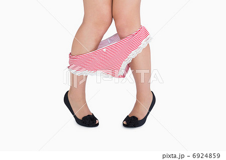 Woman in sexy panties undressing 6924859