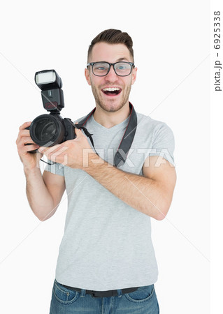Portrait of cheerful photographer with photographic camera 6925338