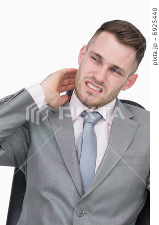 Young business man with neck pain Young business man with neck pain 6925440