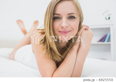 Portrait of beautiful relaxed woman in bed 6925550