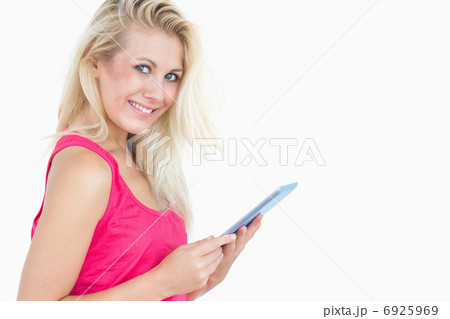 Portrait of happy casual woman with digital tablet 6925969
