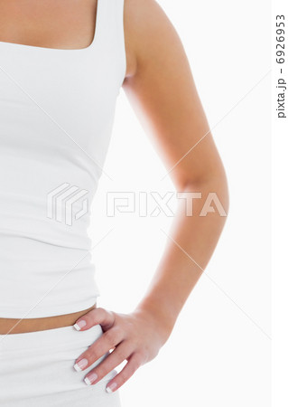Midsection of fit woman in sportswear with hand on hip Midsection of fit woman in sportswear with hand on hip 6926953