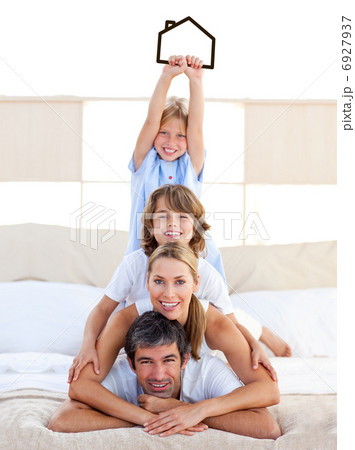 Jolly family having fun with black house illustration 6927937