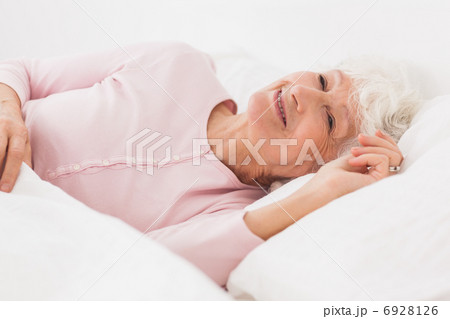 Happy woman in bed 6928126