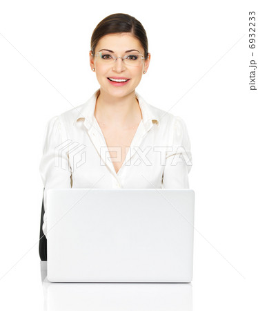 woman sits from the  table with laptop in white shirt 6932233
