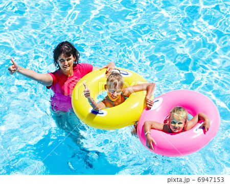 Family in swimming pool. Family in swimming pool. 6947153