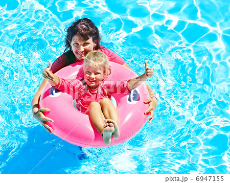 Family in swimming pool. Family in swimming pool. 6947155
