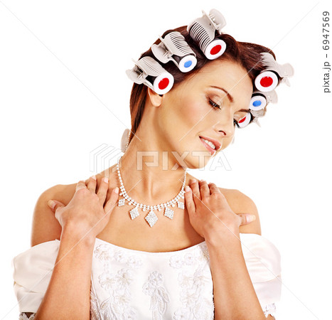 Woman wear hair curlers on head. Woman wear hair curlers on head. 6947569