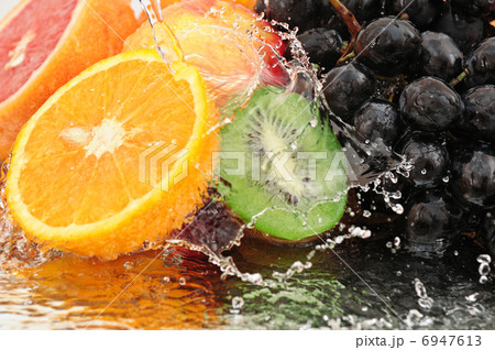 Pure fruit in a spray of water 6947613
