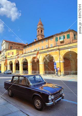 Old black car on the street in Bra, Italy. 6947644
