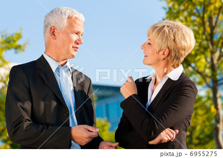 Business people talking outdoors 6955275
