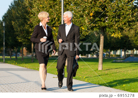 Business people talking outdoors Business people talking outdoors 6955278