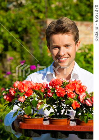 Gardening in summer - man with flowers Gardening in summer - man with flowers 6955370