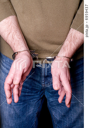 hands in handcuffs 6959437