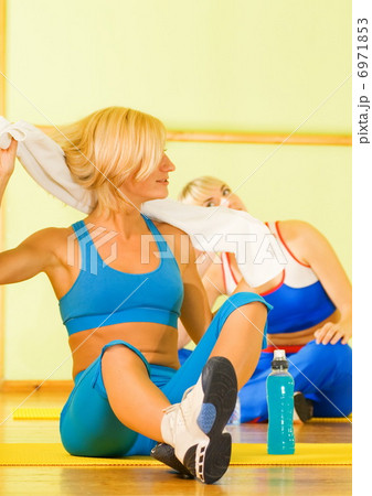 Beautiful women relaxing after fitness exercise 6971853