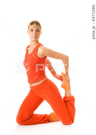 Beautiful young woman doing yoga exercise isolated on white back Beautiful young woman doing yoga exercise isolated on white back 6971980