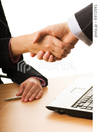 Business man and business woman making a treaty 6972091