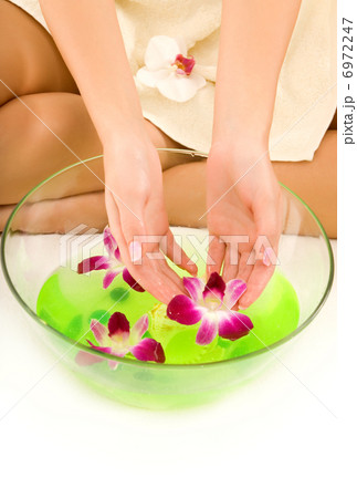 Girl washing hands in aroma water Girl washing hands in aroma water 6972247