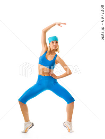 Beautiful young woman doing fitness exercise isolated on white b 6972309