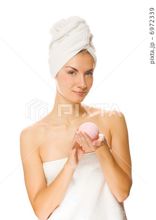 Beautiful young woman with aroma bath ball isolated on white bac Beautiful young woman with aroma bath ball isolated on white bac 6972339