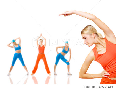 Group of women doing fitness exercise isolated on white. Lots of 6972384