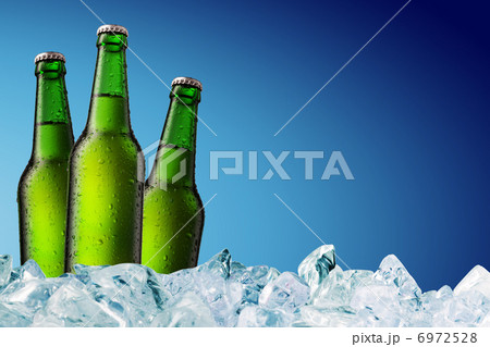 Beer Bottle with water drops on the white 6972528