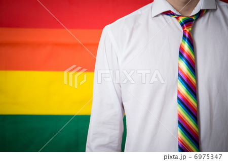 Man wearing shirt and rainbow tie 6975347