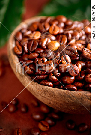 Coffee beans. Bowl of Aromatic Coffee close-up 6976496