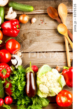 Healthy Organic Vegetables on a Wood Background 6976526